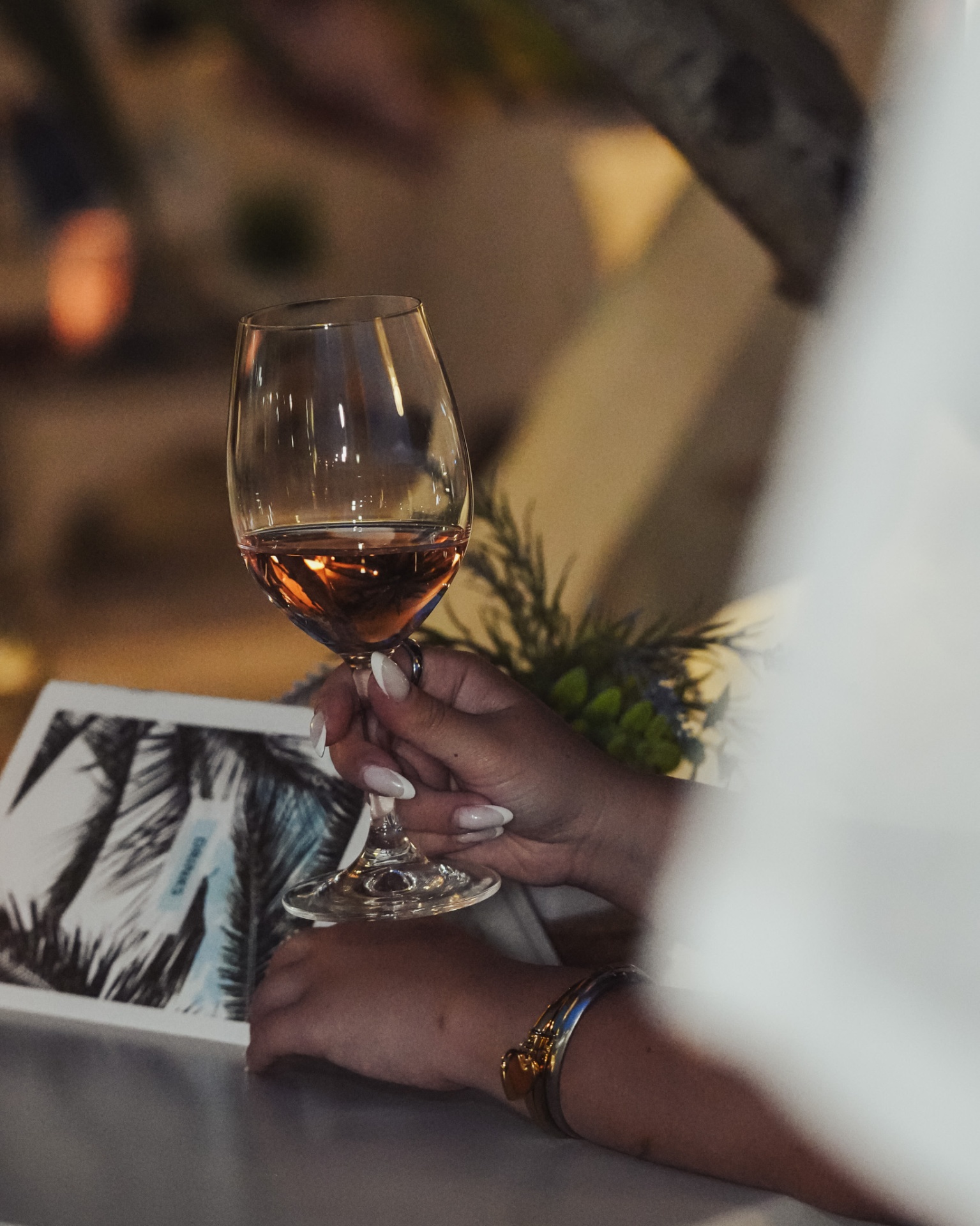 Guest enjoying a glass of rosé wine