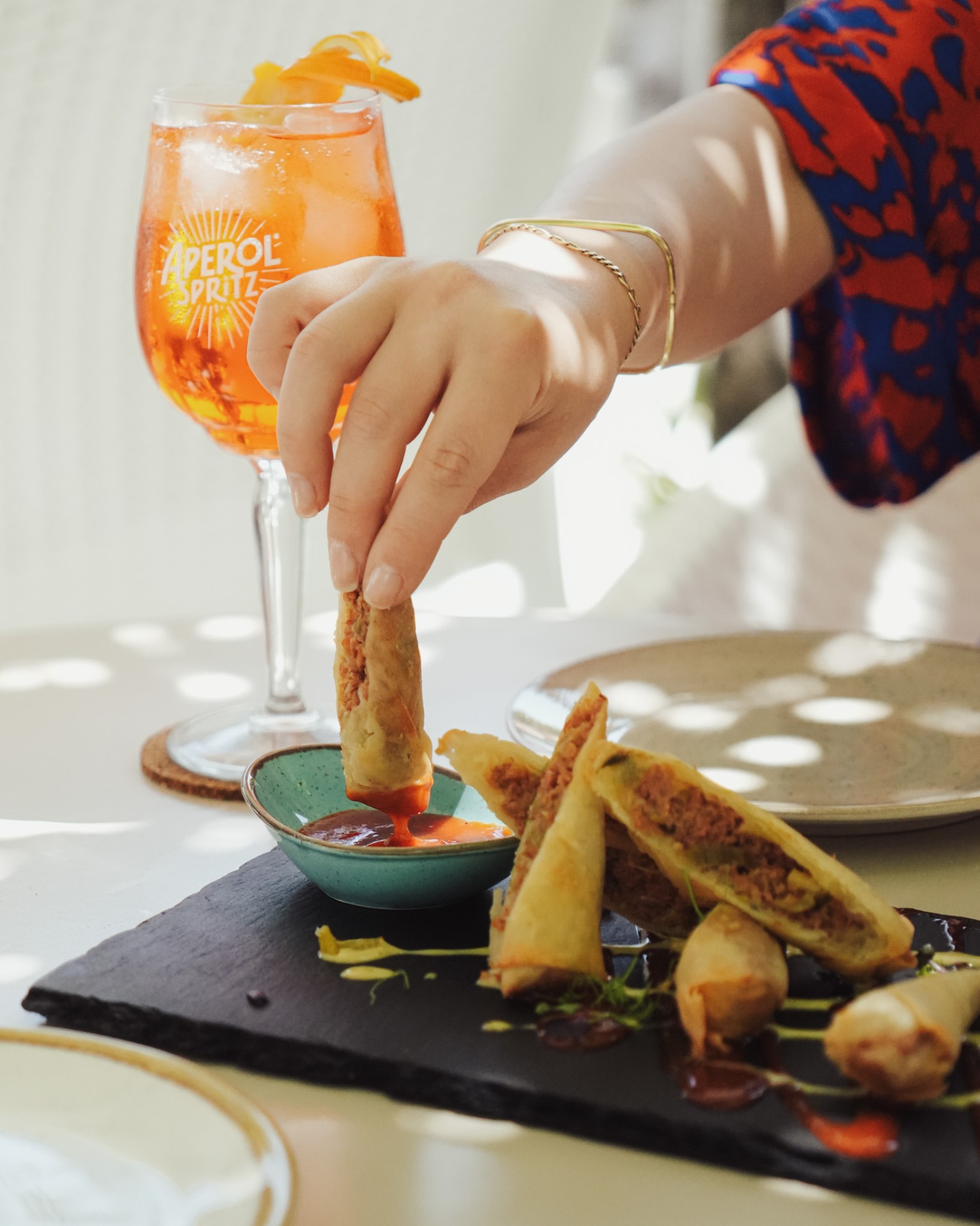 Aperol Spritz with crispy spring rolls