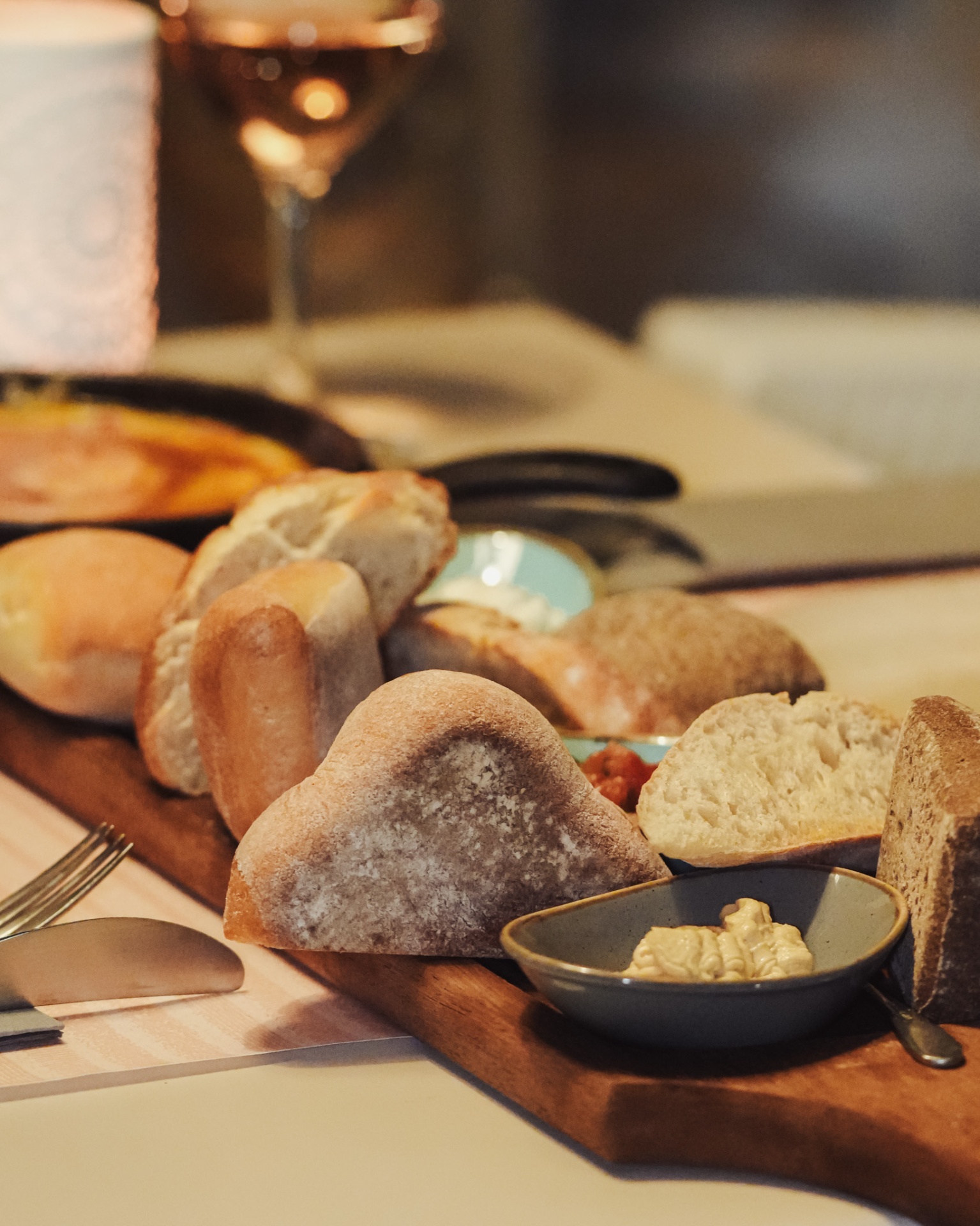 Artisan bread basket with rosé wine
