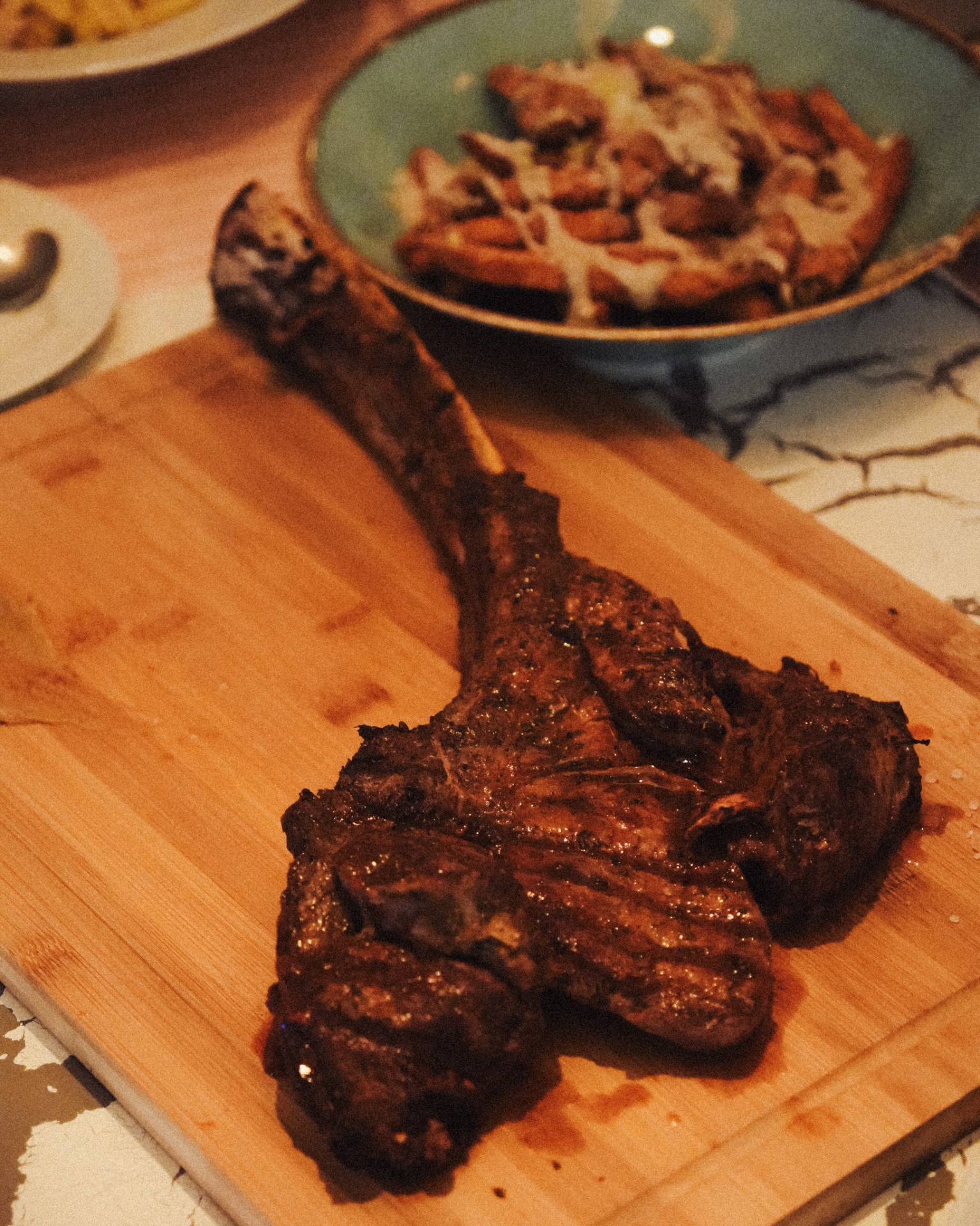 Grilled tomahawk steak on a wooden board